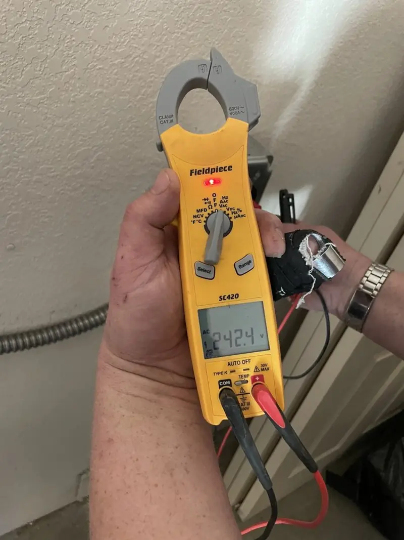 Voltage testing with clamp meter during Whole House Surge Protector in Ellwood City